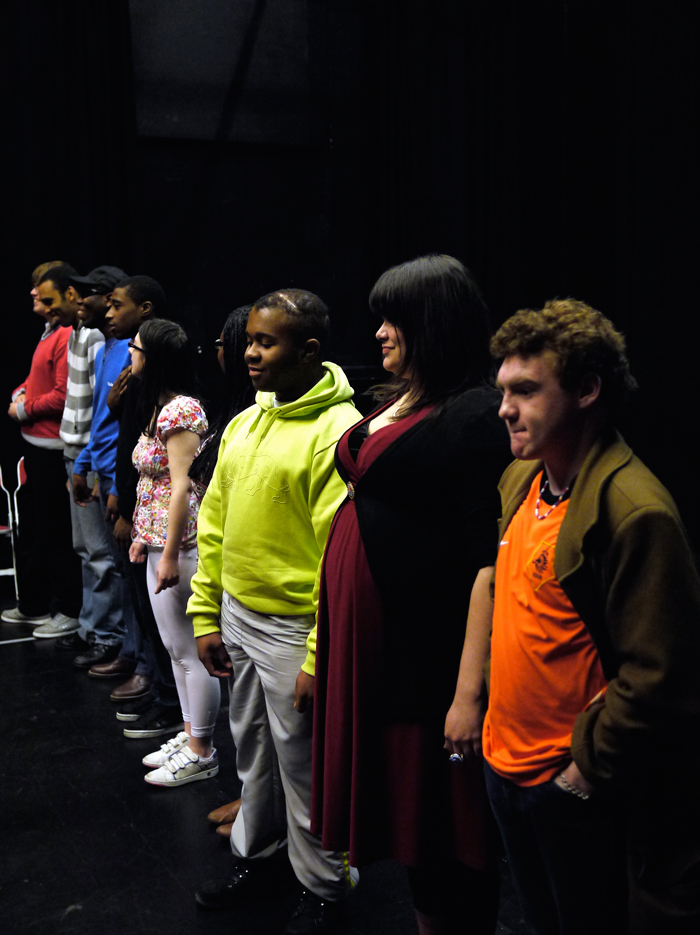 A shot panning across all of the actors who stand next to each other in one long line.