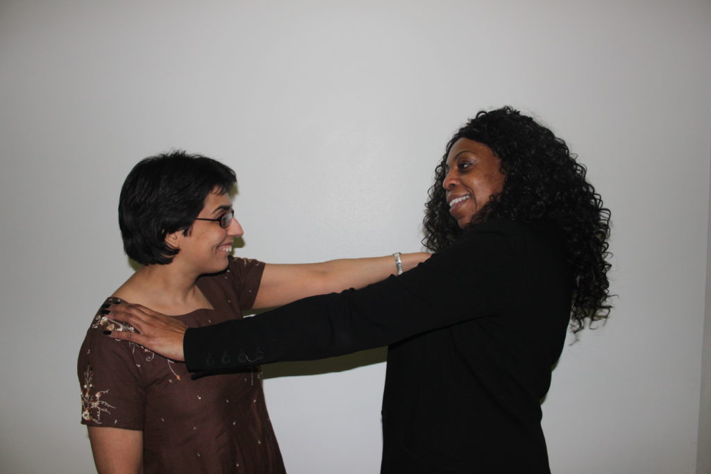 Shot of two women standing opposite one another