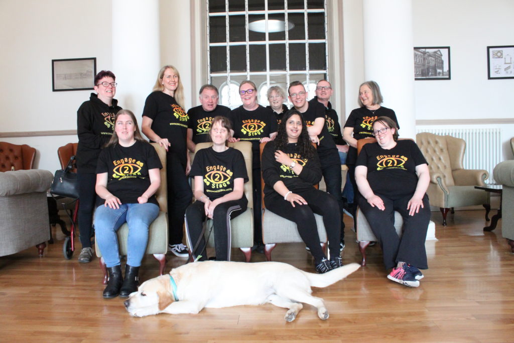 The Engage2Stage cohort pose for a relaxed photo in the lounge area of the Met