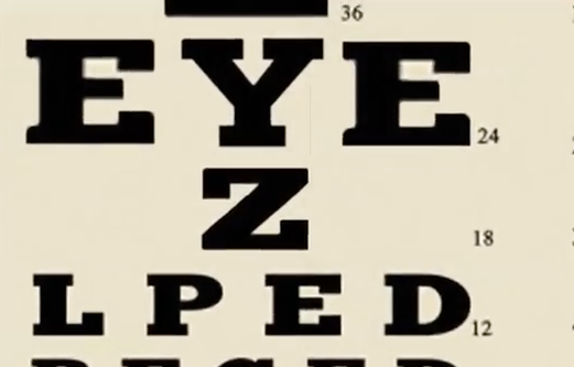 Image still from the trailer video showing an eye chart - amongst the letters