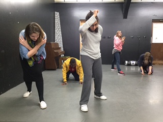 five young participants for Sportivate Birmingham workshop assume different poses in a forwards motion