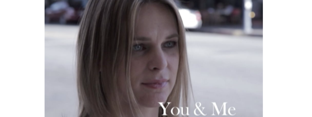 Headshot of a young woman with long hair and the title You & Me