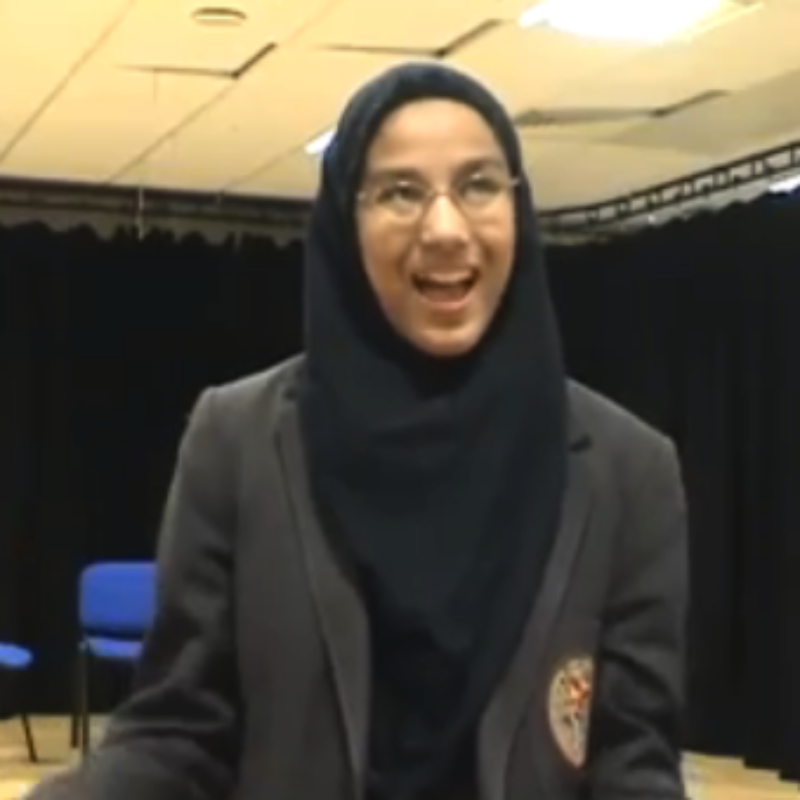 Schoolgirl in hijab being interviewed. Film of a participation project