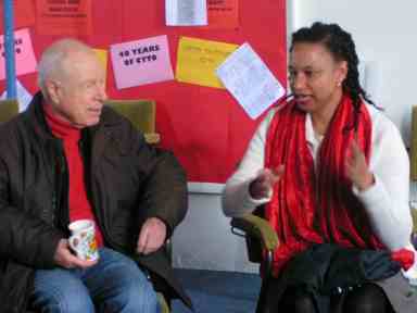 Peter brook having a coffee whilst discussing the production with Extant staff