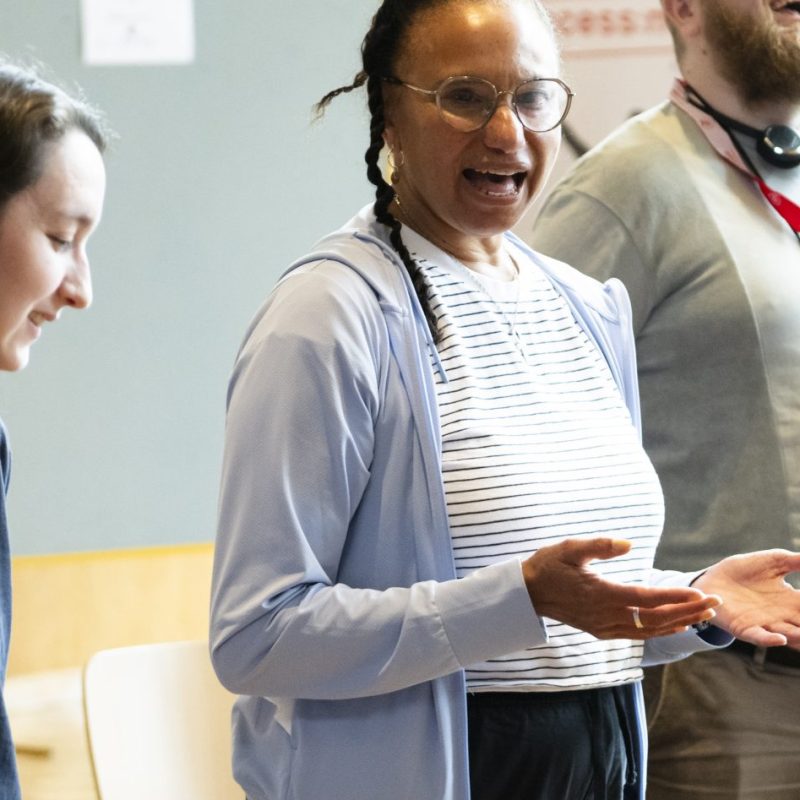 Maria is talking in a workshop space to participants.