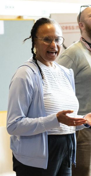 Maria is talking in a workshop space to participants.